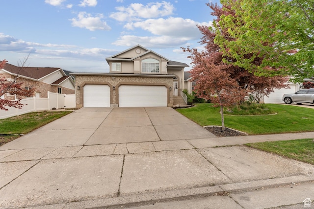 4948 S 1150 E, Ogden, UT 84403 - traditional home featuring driveway, stucco siding, an attached garage, and brick siding