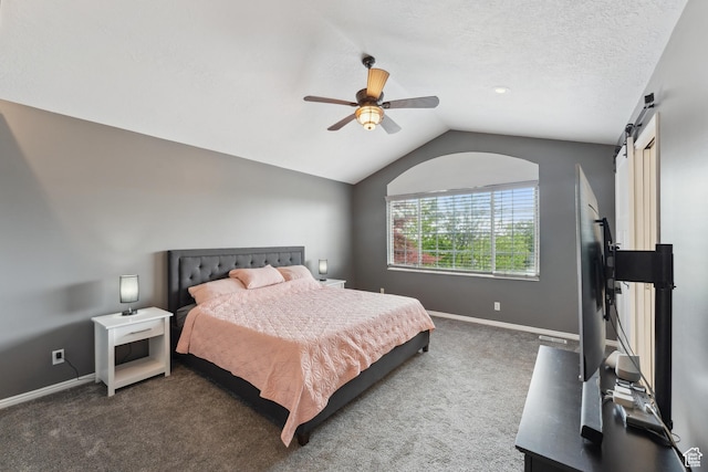 4948 S 1150 E, Ogden, UT 84403 - bedroom with vaulted ceiling, carpet floors, baseboards, a ceiling fan, and a barn door