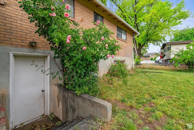view of property exterior with brick siding