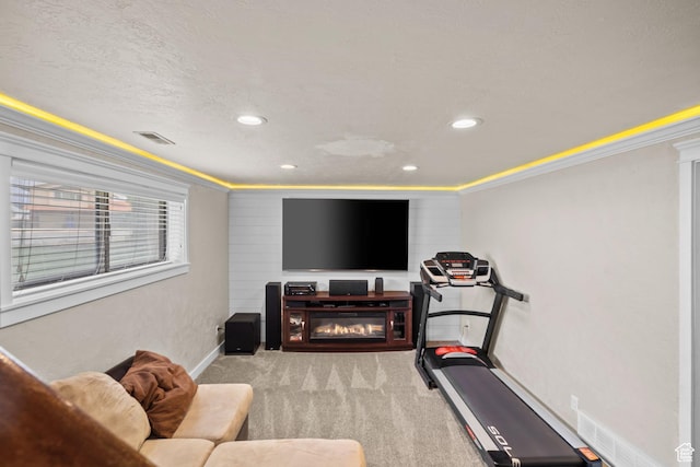 exercise room with ornamental molding, recessed lighting, carpet floors, and baseboards