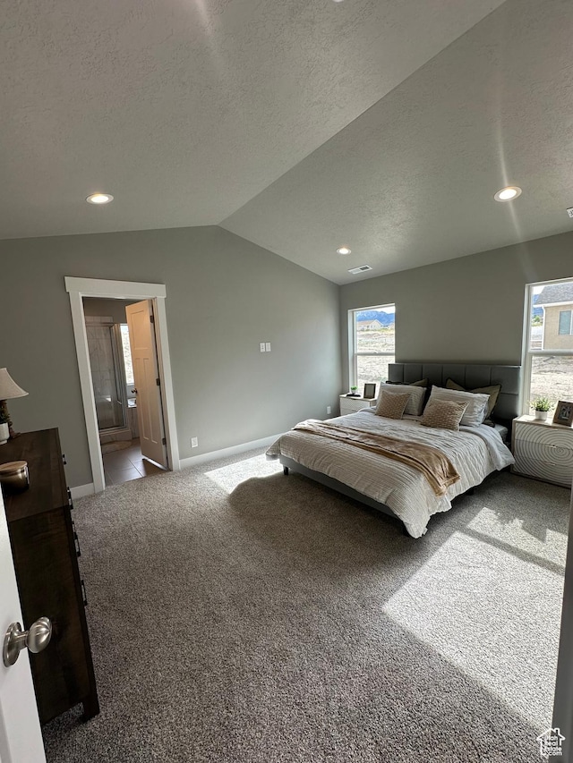 carpeted bedroom featuring vaulted ceiling, baseboards, a textured ceiling, recessed lighting, and ensuite bathroom