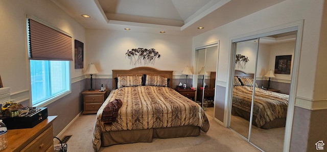 bedroom featuring two closets, carpet flooring, and recessed lighting