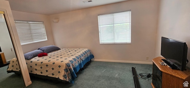 bedroom featuring carpet flooring and baseboards