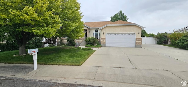 view of front of home featuring concrete driveway, a garage, and stucco siding