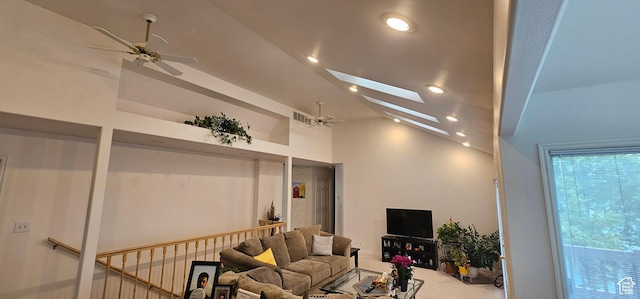 living area featuring a ceiling fan, lofted ceiling, carpet floors, a skylight, and recessed lighting
