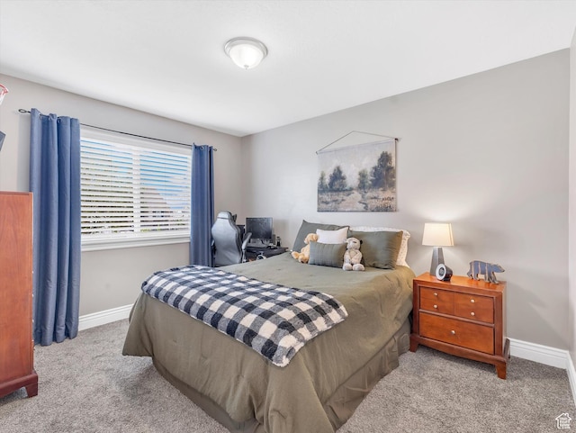 bedroom featuring carpet flooring and baseboards