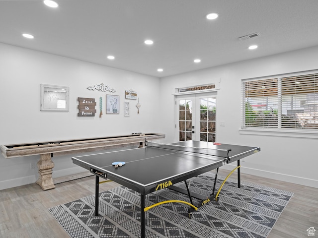 rec room with french doors, recessed lighting, baseboards, and light wood finished floors
