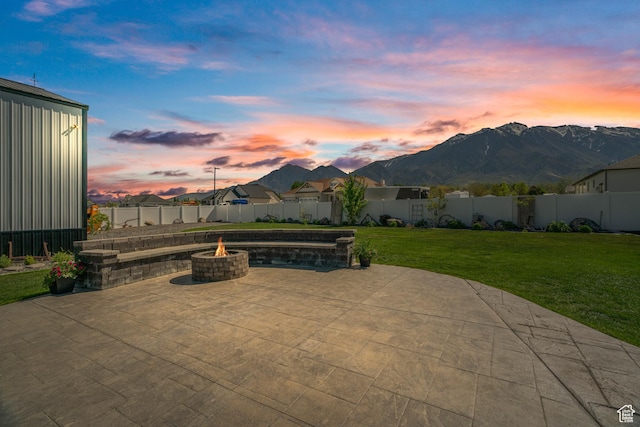 view of patio featuring a fire pit and a mountain view