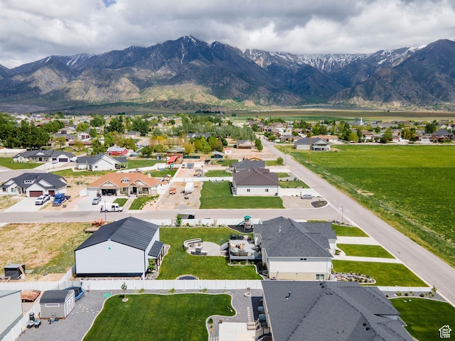 aerial view of residential area featuring mountains
