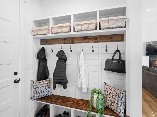 mudroom with light wood finished floors