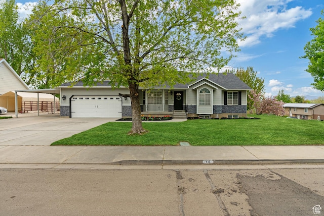 single story home featuring a front lawn, a garage, concrete driveway, and a carport
