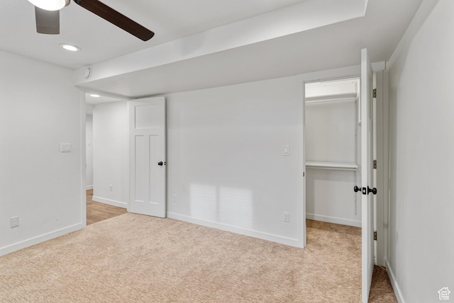 unfurnished bedroom featuring carpet flooring, baseboards, a spacious closet, recessed lighting, and ceiling fan