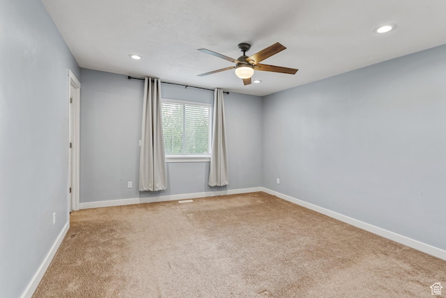 carpeted empty room with a ceiling fan, recessed lighting, and baseboards