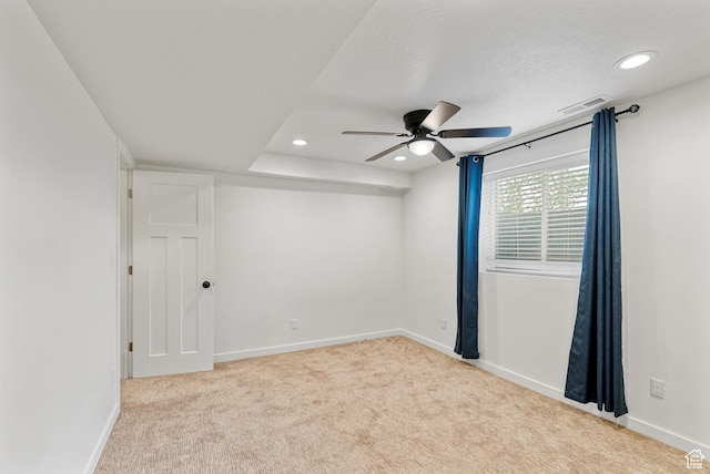 carpeted spare room featuring a ceiling fan, baseboards, and recessed lighting