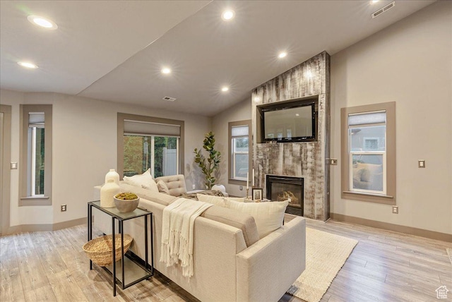 59 W 600 N, Farmington, UT 84025 - living area featuring light wood-style flooring, a fireplace, recessed lighting, baseboards, and lofted ceiling