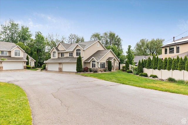 59 W 600 N, Farmington, UT 84025 - traditional home featuring asphalt driveway and an attached garage