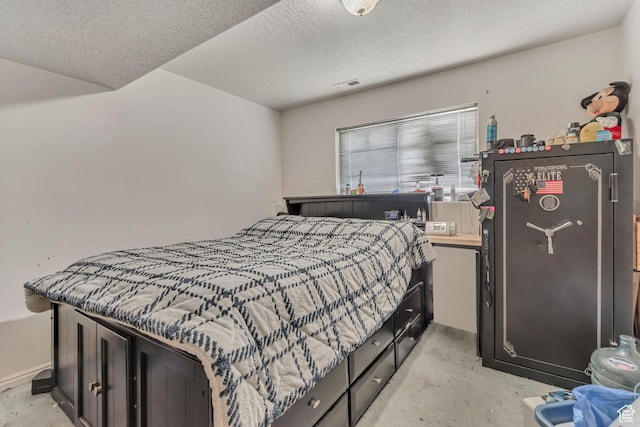 bedroom featuring a textured ceiling