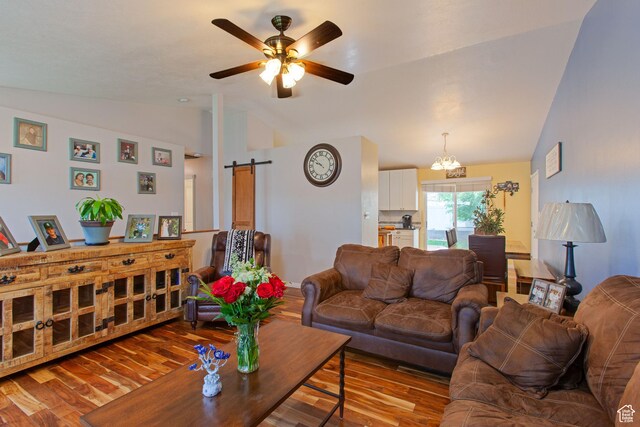 841 W 1235 S, Payson, UT 84651 - living area with lofted ceiling, wood finished floors, a barn door, and ceiling fan