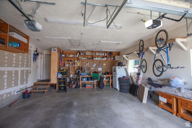 841 W 1235 S, Payson, UT 84651 - garage with a garage door opener, a workshop area, and freestanding refrigerator