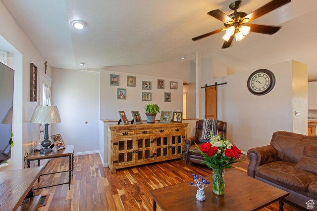 841 W 1235 S, Payson, UT 84651 - living area with a barn door, wood finished floors, vaulted ceiling, ceiling fan, and baseboards