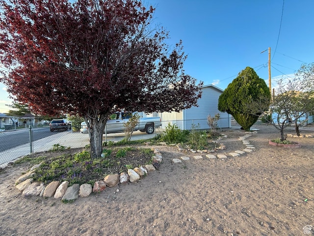 view of front of house featuring fence