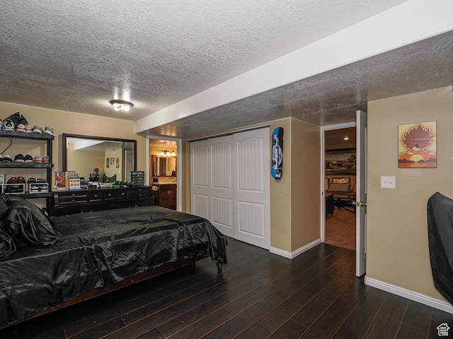 3263 W Blue Moon Ln, South Jordan, UT 84095 - bedroom featuring baseboards, a textured ceiling, wood finished floors, a closet, and ensuite bath