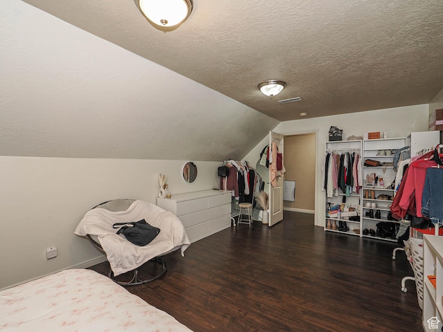 3263 W Blue Moon Ln, South Jordan, UT 84095 - bedroom featuring wood finished floors, a textured ceiling, lofted ceiling, and baseboards