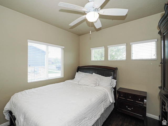3263 W Blue Moon Ln, South Jordan, UT 84095 - bedroom with dark wood-type flooring, baseboards, and ceiling fan