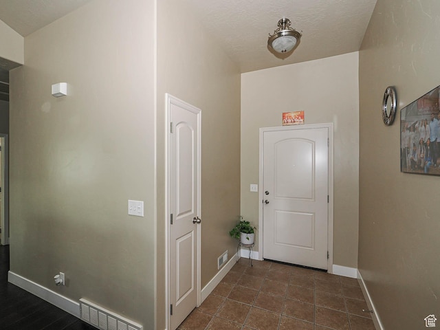 3263 W Blue Moon Ln, South Jordan, UT 84095 - foyer featuring baseboards and dark tile patterned flooring