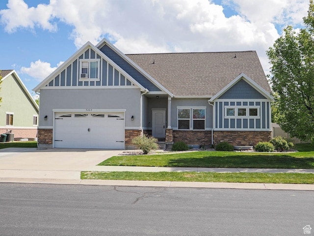 3263 W Blue Moon Ln, South Jordan, UT 84095 - craftsman house with stone siding, driveway, stucco siding, and a front yard
