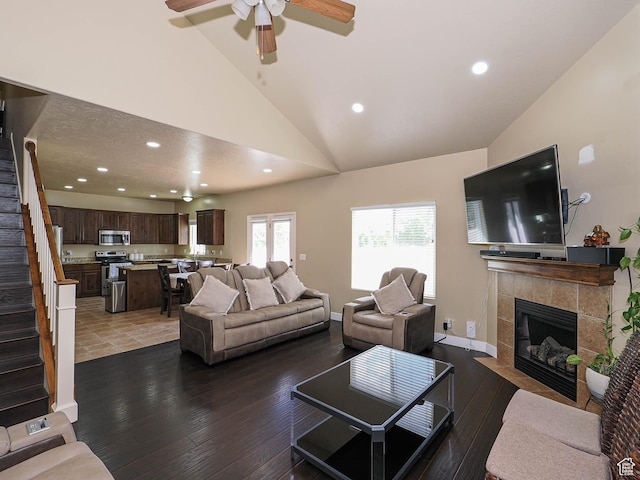 3263 W Blue Moon Ln, South Jordan, UT 84095 - living room featuring stairs, vaulted ceiling, hardwood / wood-style flooring, recessed lighting, and a fireplace
