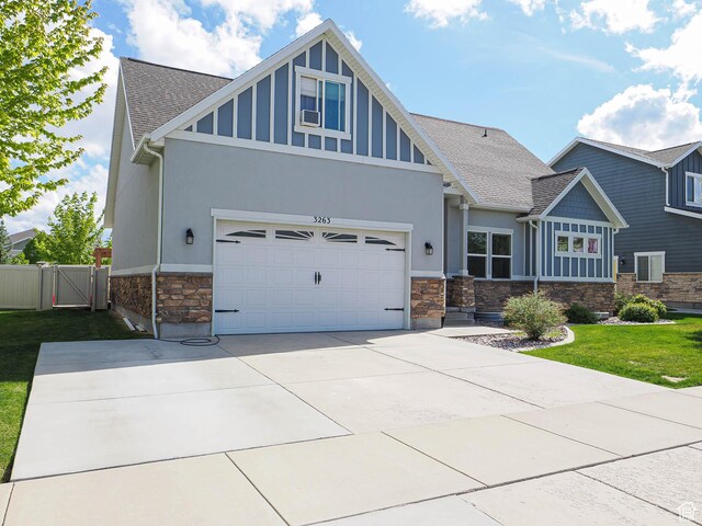3263 W Blue Moon Ln, South Jordan, UT 84095 - craftsman-style house featuring stone siding, a shingled roof, stucco siding, and a gate