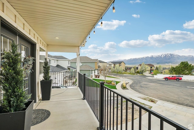 balcony featuring a mountain view and a residential view