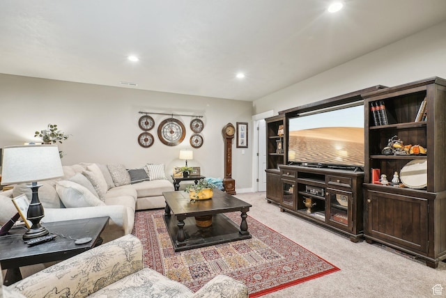 living area featuring light colored carpet, recessed lighting, and baseboards