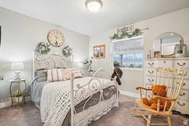 carpeted bedroom featuring baseboards