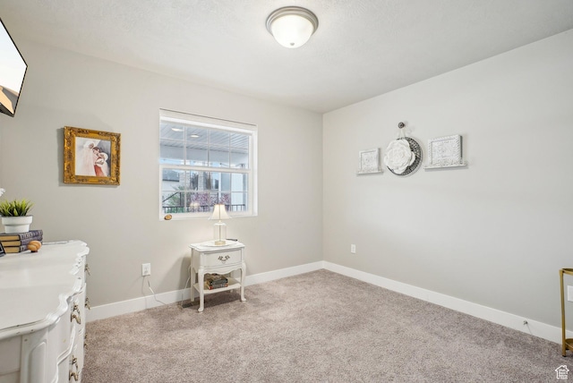 office space with carpet and baseboards