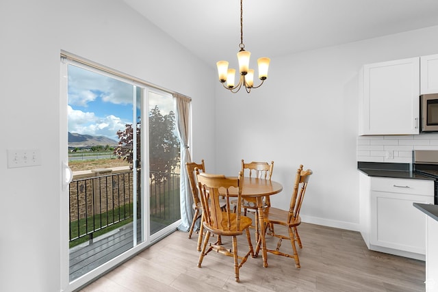 876 S Brubaker Way, Santaquin, UT 84655 - dining area featuring a chandelier and light wood-style floors