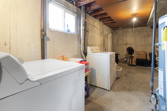 below grade area featuring washer and clothes dryer and gas water heater