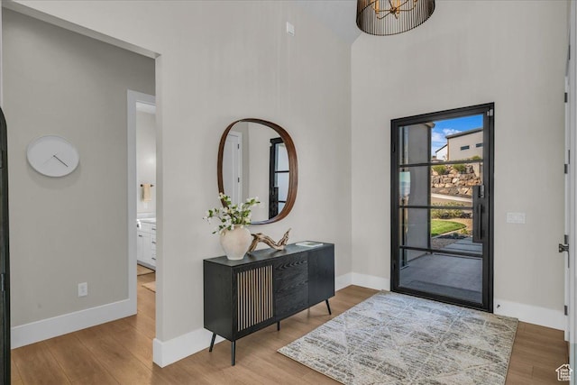 1003 N Grand Heights Dr, St George, UT 84770 - entrance foyer with wood finished floors, baseboards, and a towering ceiling