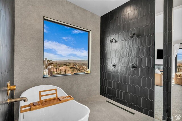 1003 N Grand Heights Dr, St George, UT 84770 - bathroom with a tile shower and a freestanding tub