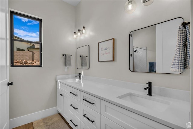 1003 N Grand Heights Dr, St George, UT 84770 - full bath with double vanity, baseboards, and a shower