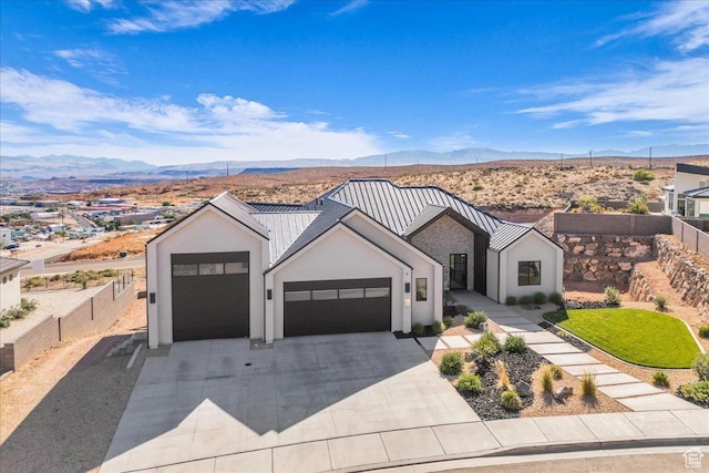 1003 N Grand Heights Dr, St George, UT 84770 - modern inspired farmhouse featuring a mountain view, stucco siding, concrete driveway, a garage, and fence