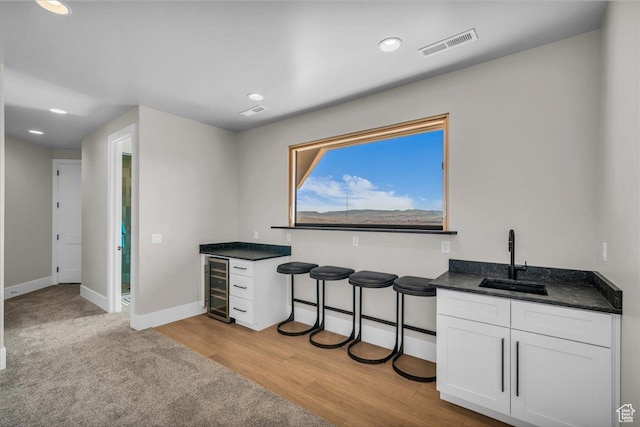 1003 N Grand Heights Dr, St George, UT 84770 - indoor dry bar with wine cooler, baseboards, recessed lighting, and light wood finished floors
