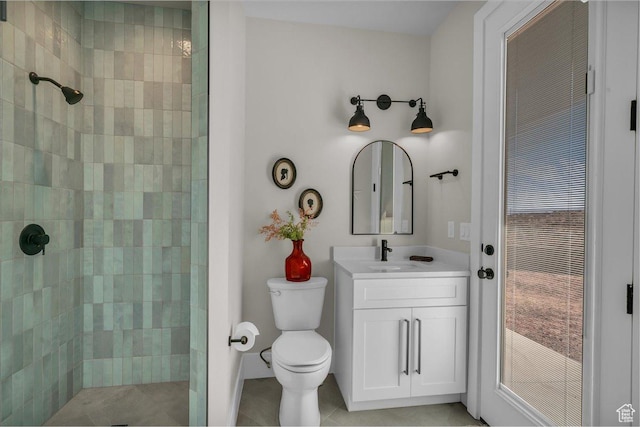 1003 N Grand Heights Dr, St George, UT 84770 - full bath featuring a tile shower, toilet, vanity, and tile patterned floors
