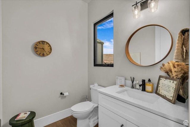 1003 N Grand Heights Dr, St George, UT 84770 - half bath with wood finished floors, baseboards, vanity, and toilet