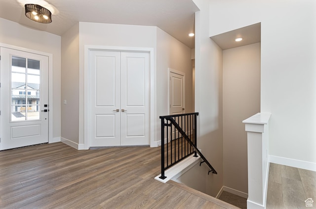 foyer with wood finished floors and baseboards