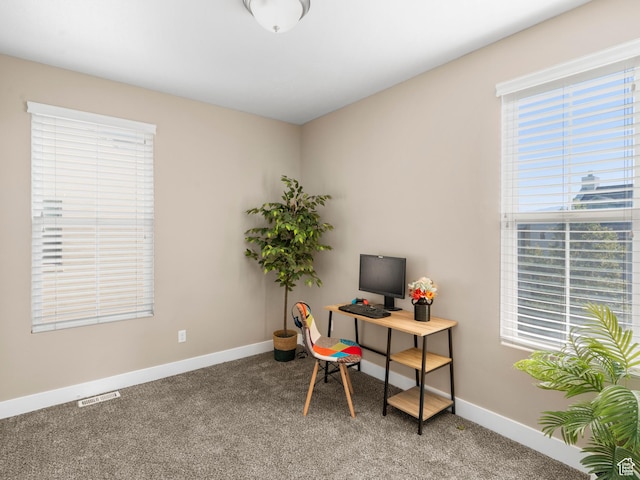office space with light colored carpet and baseboards