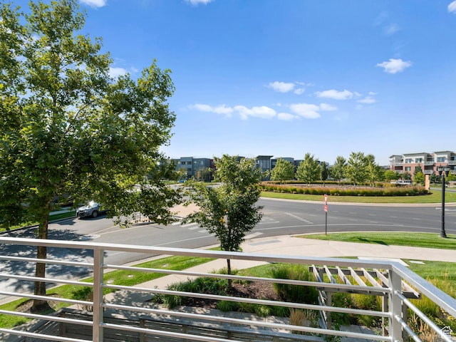 view of asphalt street with sidewalks