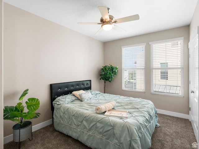 bedroom with carpet, baseboards, and a ceiling fan