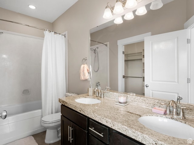 bathroom featuring toilet, shower / bath combination with curtain, double vanity, and tile patterned floors